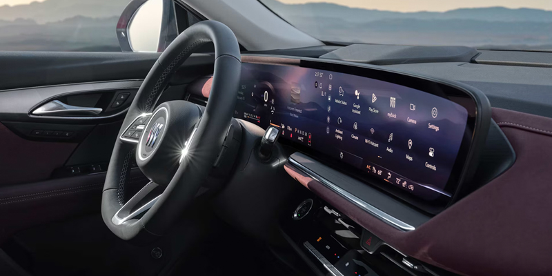 Buick SUV interior with digital dashboard, touchscreen display, and steering wheel.